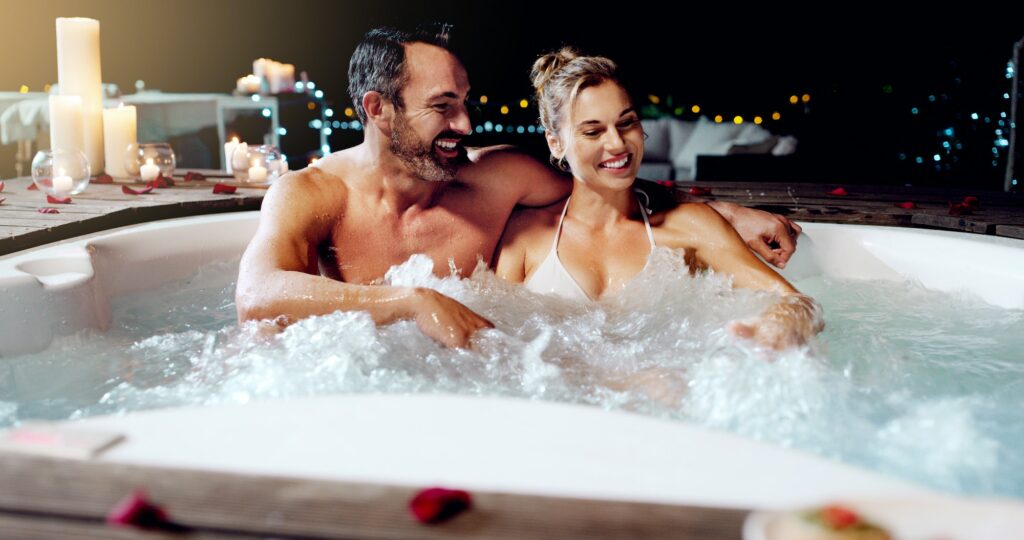 Shot of an affectionate mature couple relaxing in a hot tub together at night